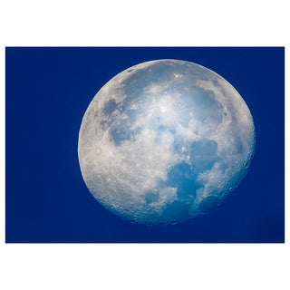 Close-up of the moon against a blue sky