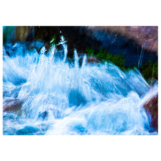 Close-up of a rushing stream with water splashes