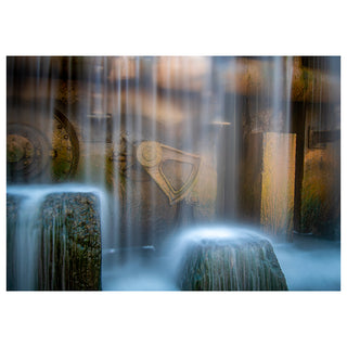 Fountain with stone sculpture and water flowing over it