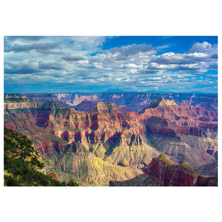 Scenic view of the Grand Canyon with a blue sky and clouds.