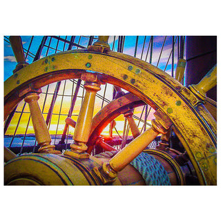 Close-up of a ship's steering wheel with a sunset through the windows in the background. Fine Art Greeting Card by Will Davis Studios Photo by Matt Punches