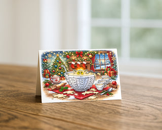 Funny Christmas greeting card featuring a cat sitting in an eggnog punch bowl, displayed on a wooden table with festive holiday illustration and cozy winter scene