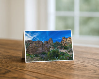 Sonoran Desert landscape with rocky formations, cactus, and dramatic blue sky in Arizona, photography greeting card by Will Davis Studios.