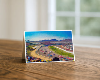 Greeting Card of a race track scene with cars on a wooden surface by Will Davis Studios