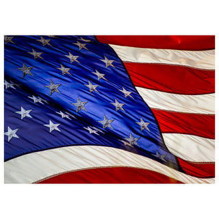 Close-up of an American flag with stars and stripes. Photo by Matt Punches