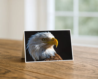 Greeting card with an eagle design on a wooden surface by Will Davis Studios