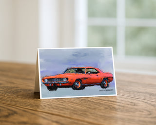 Greeting card with a 1969 Camaro muscle car on a wooden surface