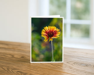 Greeting card with a sunflower design on a wooden surface Will Davis Studios