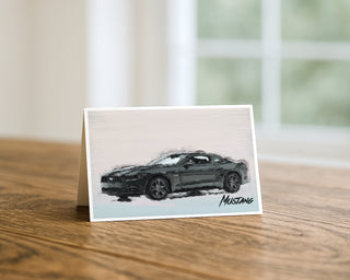 Card with a black Mustang illustration on a wooden surface will davis studios