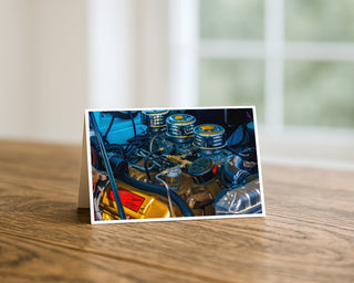 Close-up of a car engine on a wooden surface with a blurred background Will Davis Studios