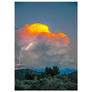 Thunderstorm with lightning strike over a mountainous landscape by Will Davis Studios