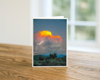 Greeting card with a stormy sky and lightning on a wooden surface by Will Davis Studios