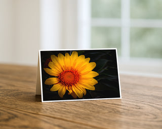 Greeting card with a yellow sunflower on a wooden surface by Will Davis Studios